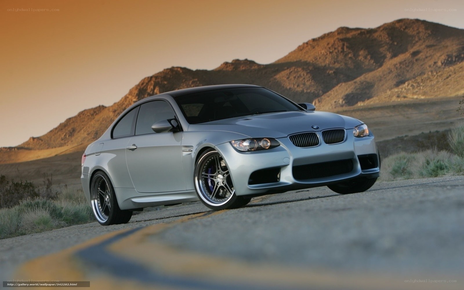 silver bmw m3 on desert road