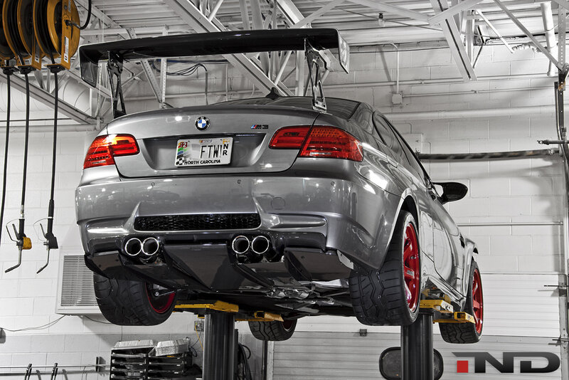 silver bmw m3 on lift
