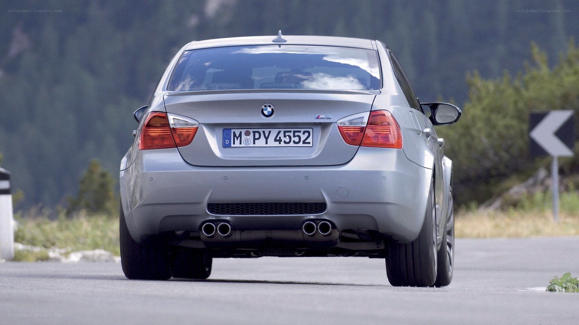 silver bmw m3 on mountain road