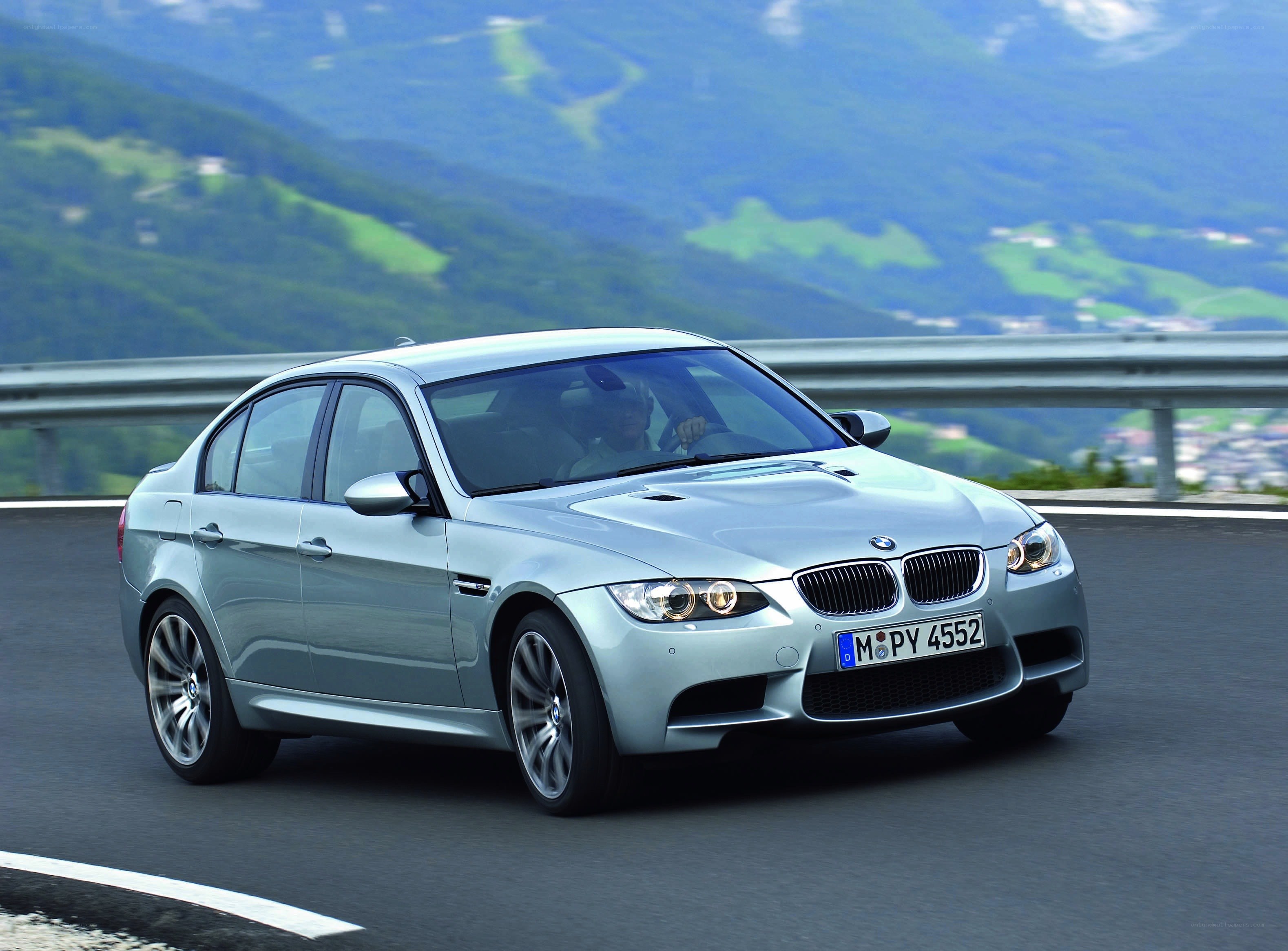 silver bmw m3 on mountain road