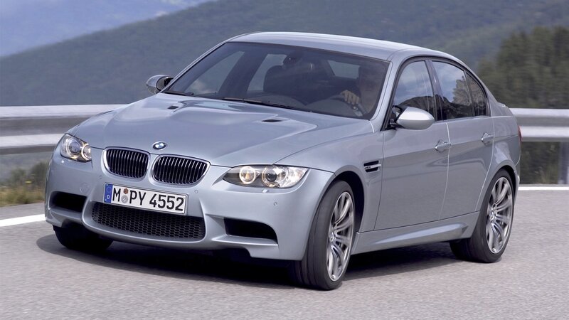 silver bmw m3 on mountain road