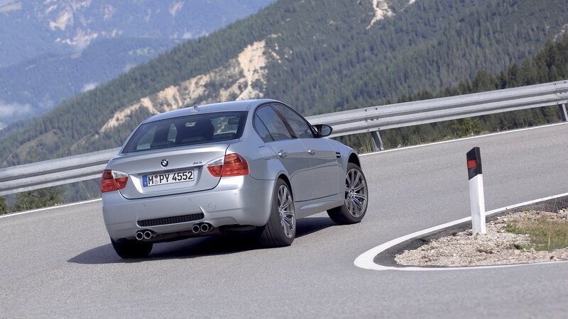 silver bmw m3 on mountain road