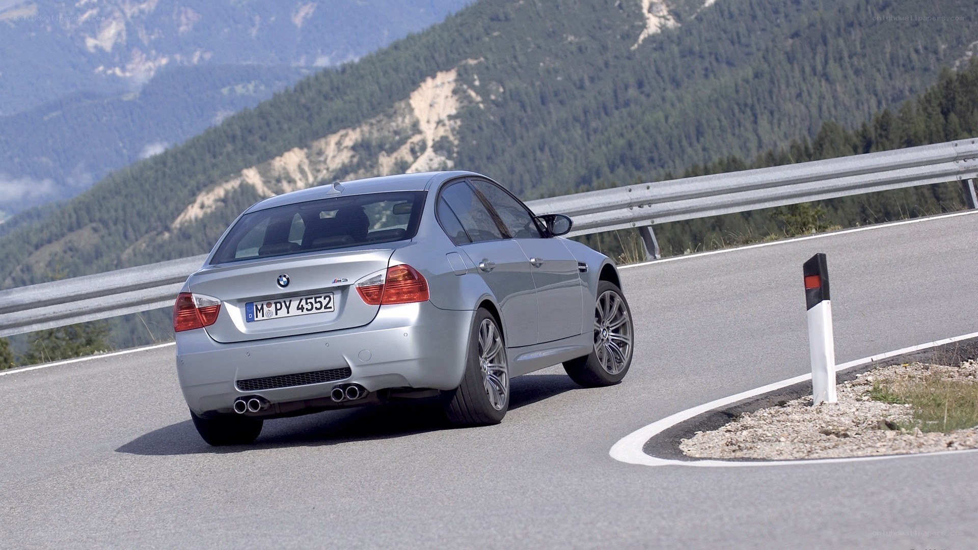 silver bmw m3 on mountain road