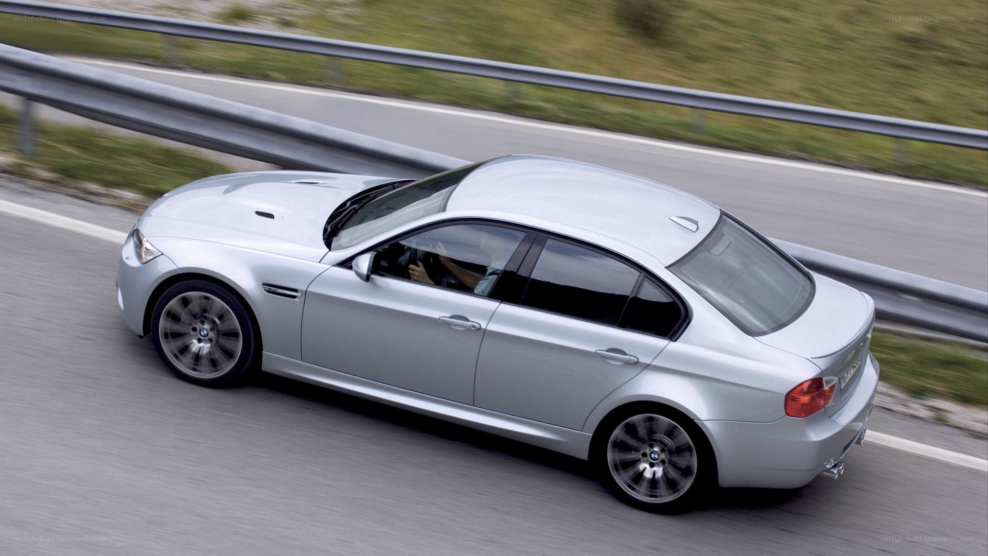 silver bmw m3 on road