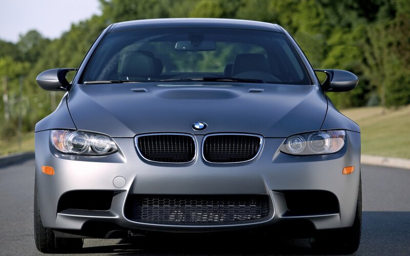 silver bmw m3 on road