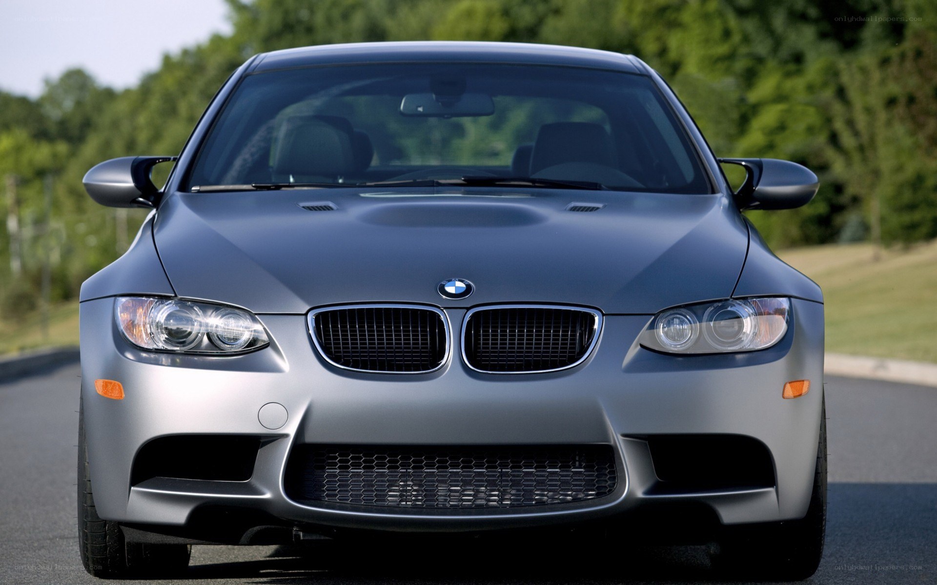 silver bmw m3 on road