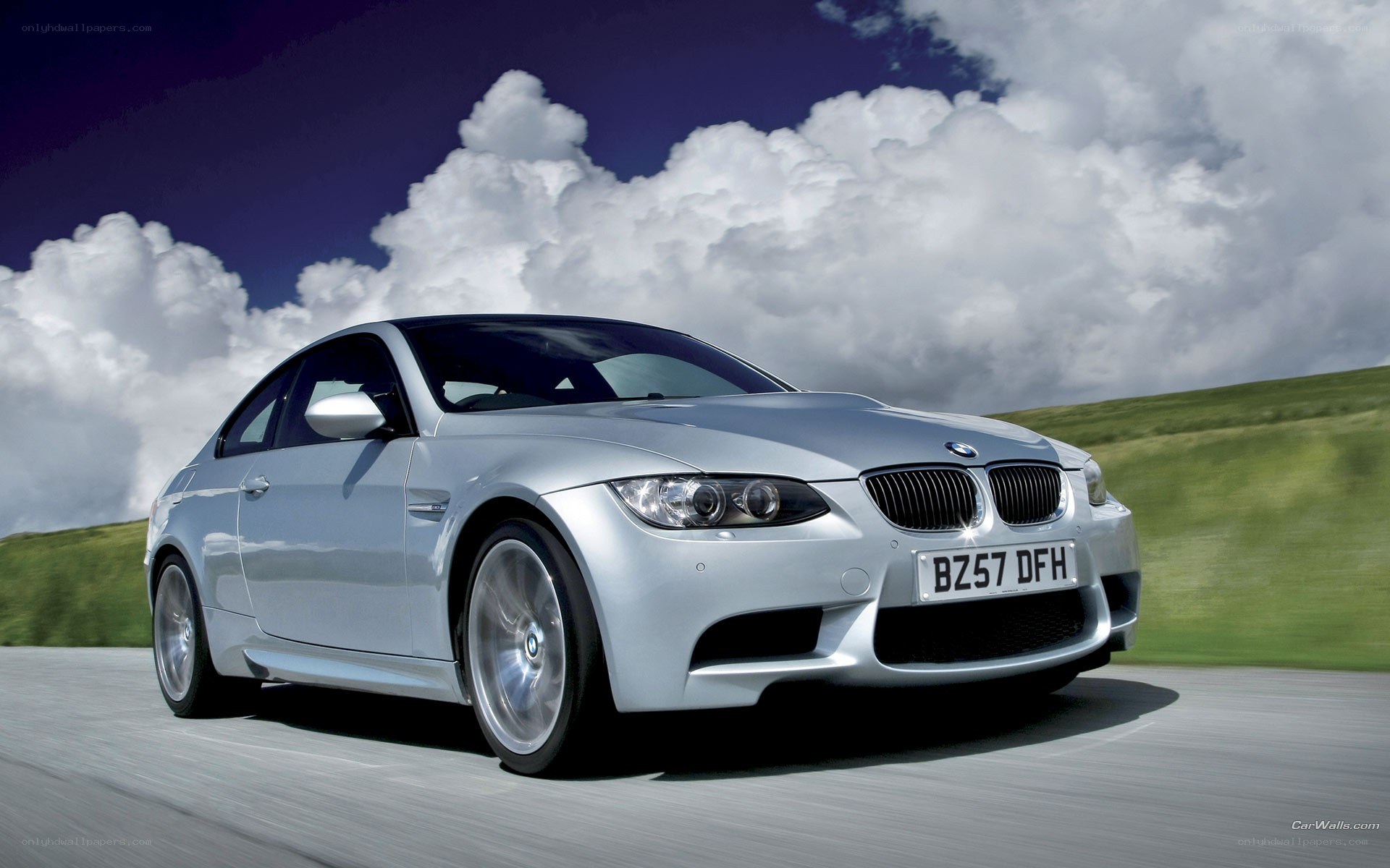 silver bmw m3 on road