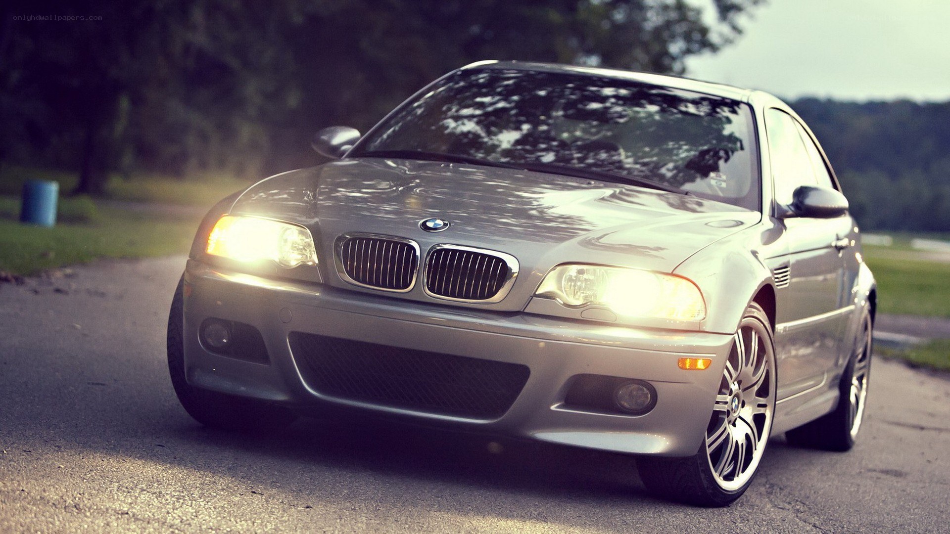 silver bmw m3 on road