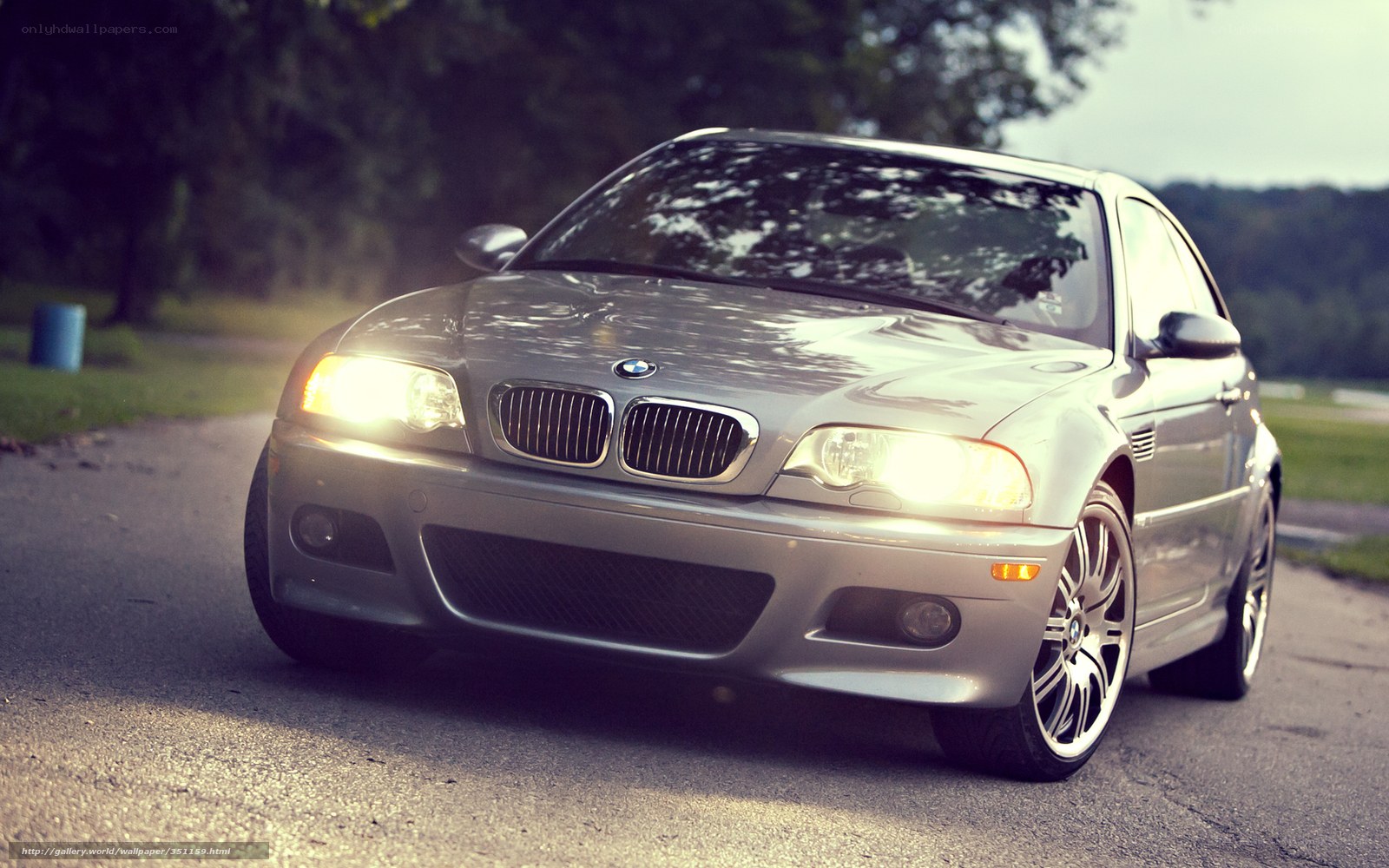 silver bmw m3 on road