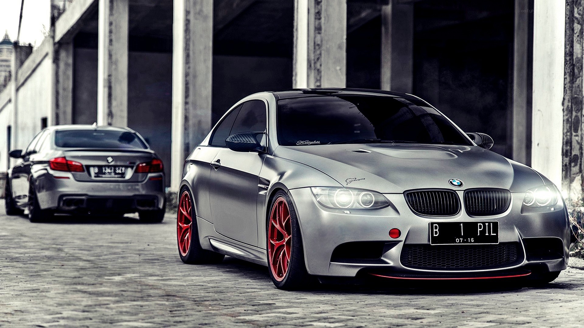 Silver BMW M3 with red wheels