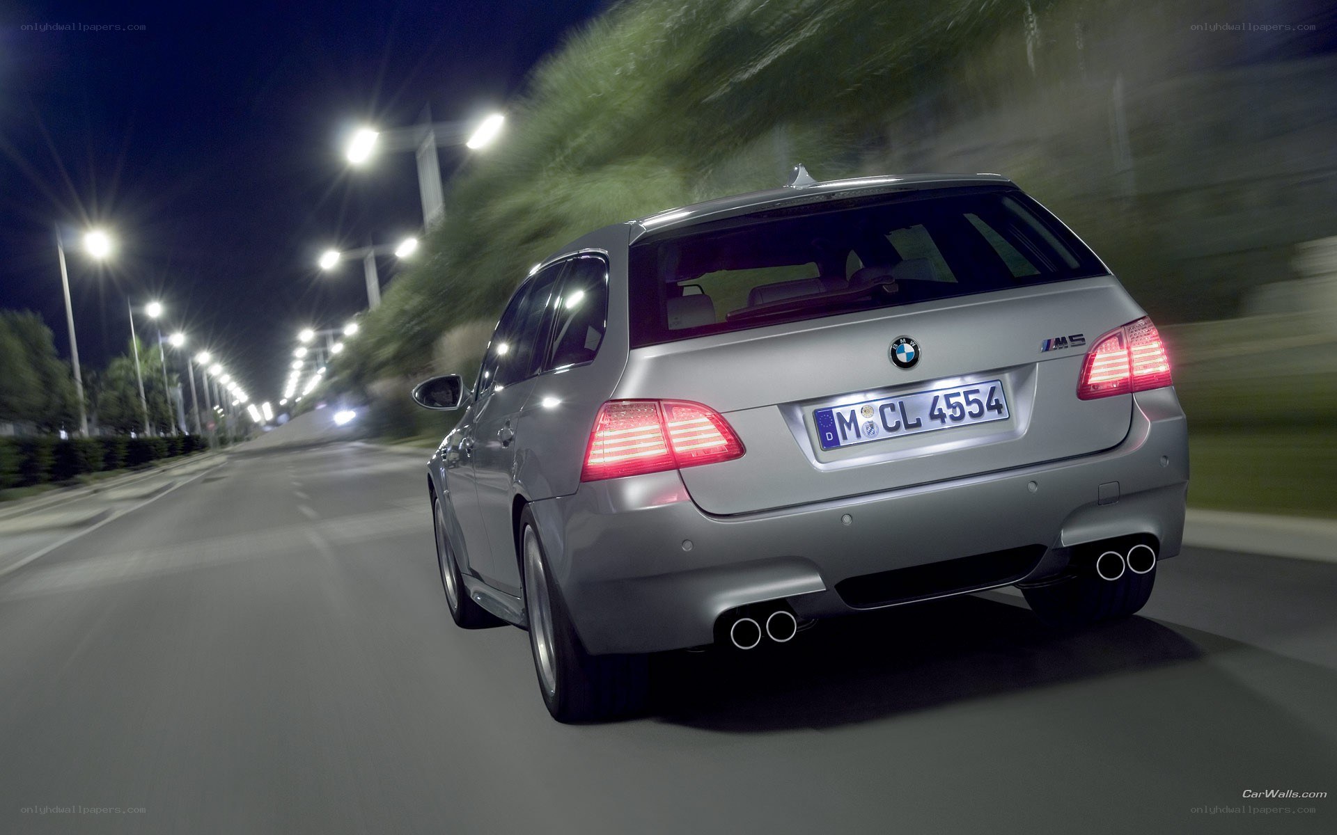 silver bmw m5 driving at night