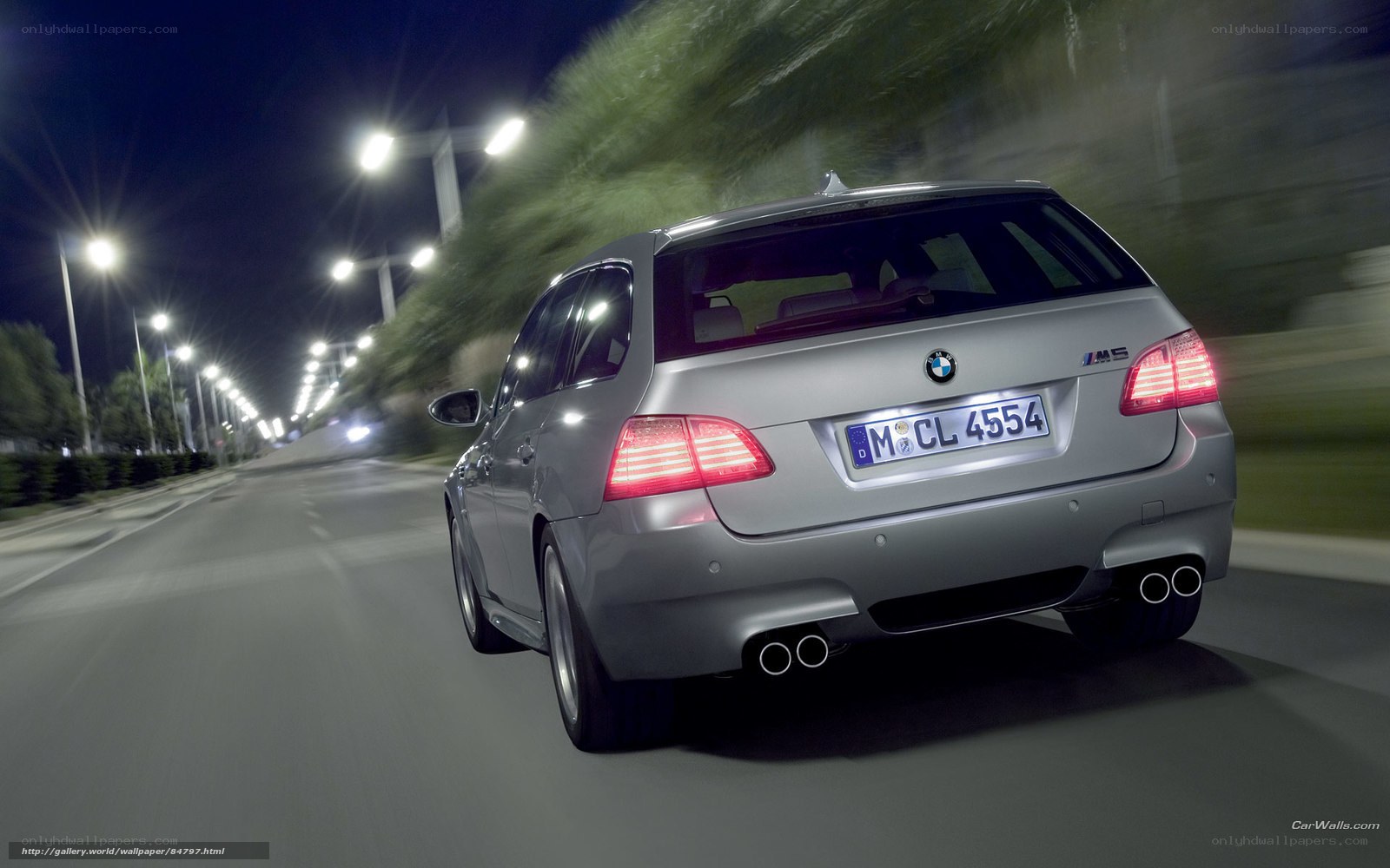 silver bmw m5 driving at night