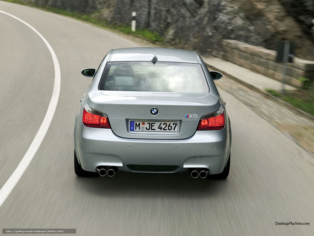 silver bmw m5 driving on road