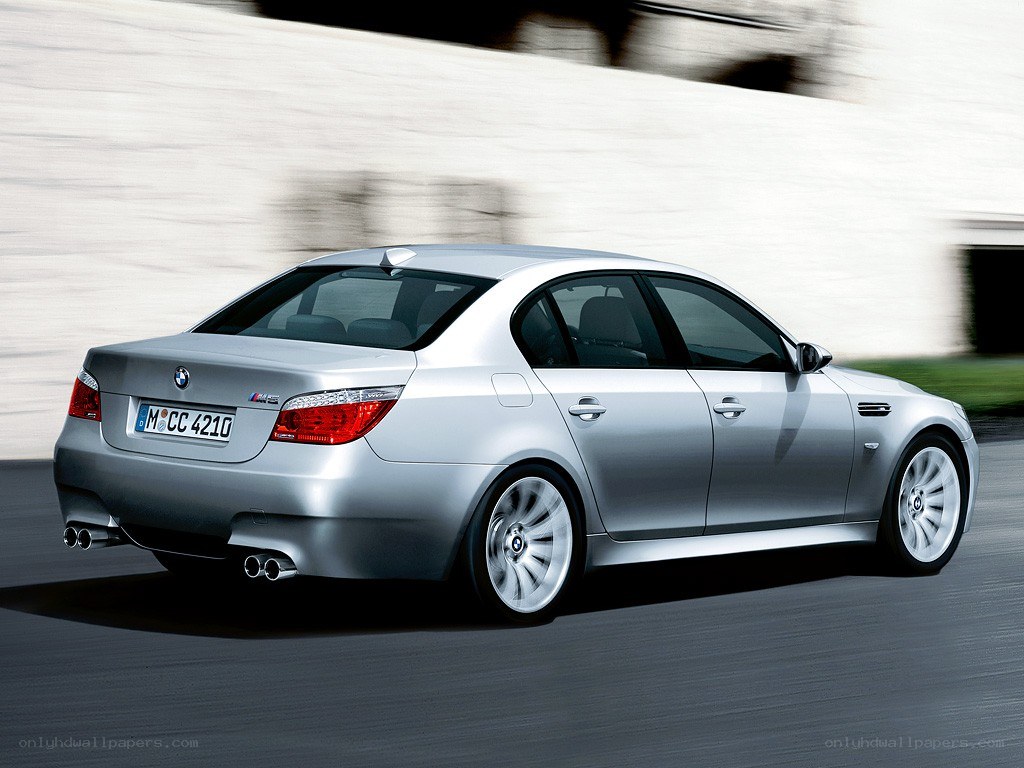 silver bmw m5 in motion