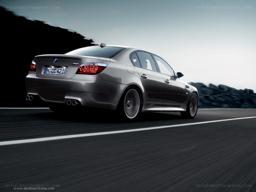 silver bmw m5 on a road