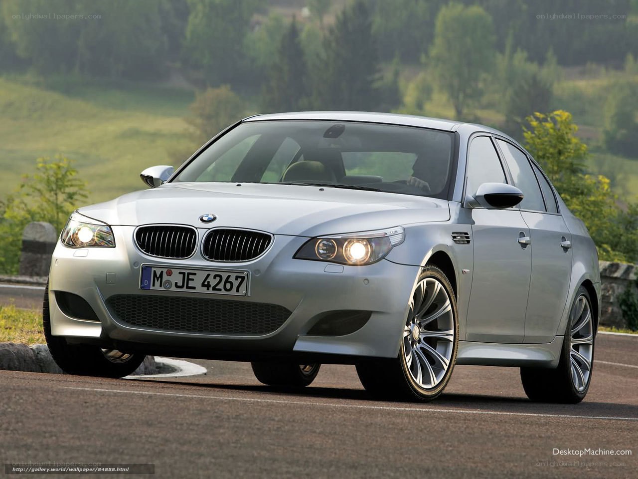 silver bmw m5 on a road