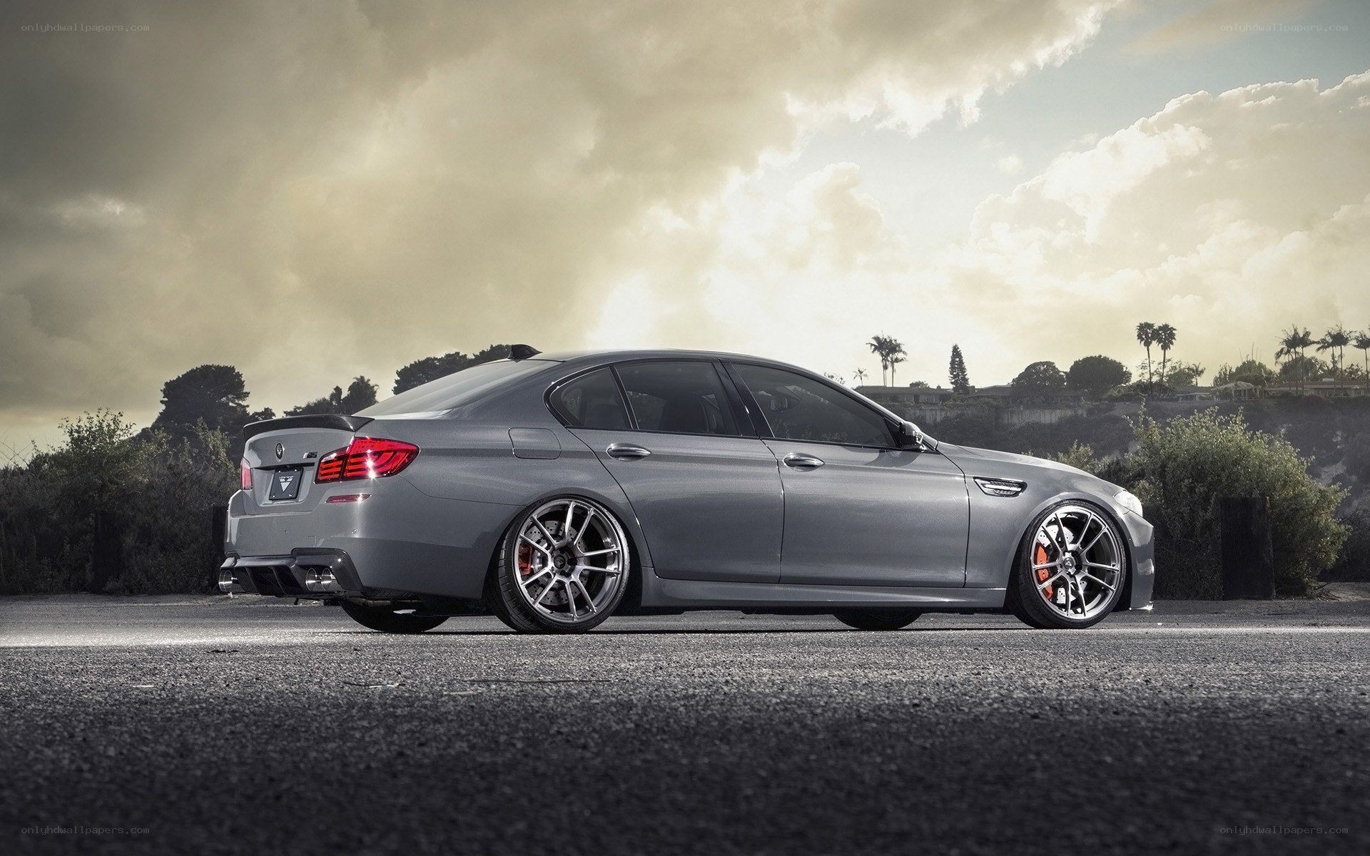 silver bmw m5 on asphalt