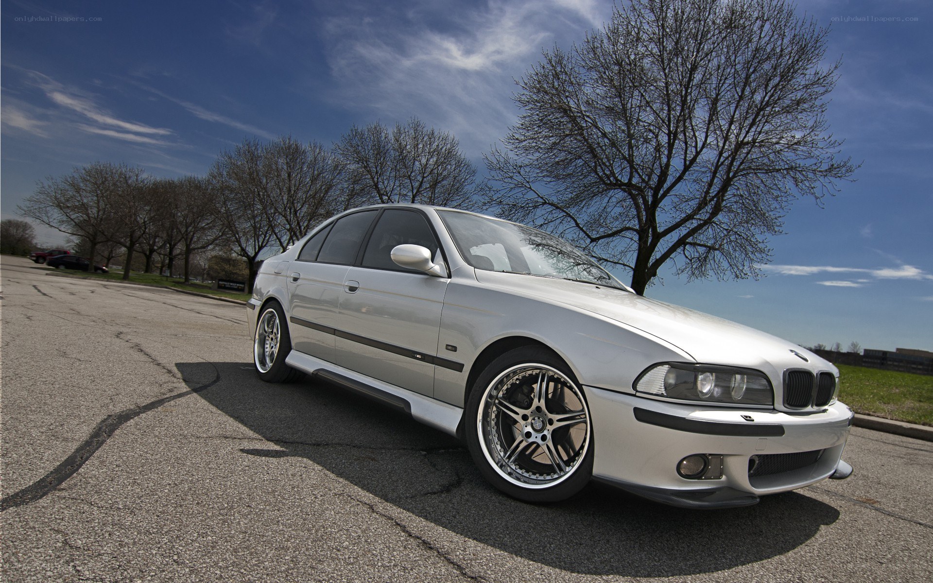 silver bmw m5 on asphalt