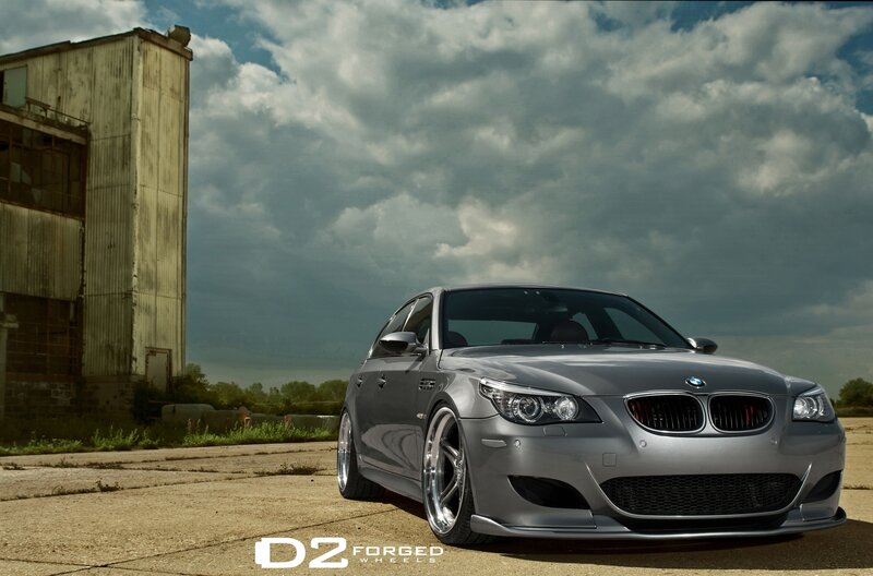 silver bmw m5 on concrete