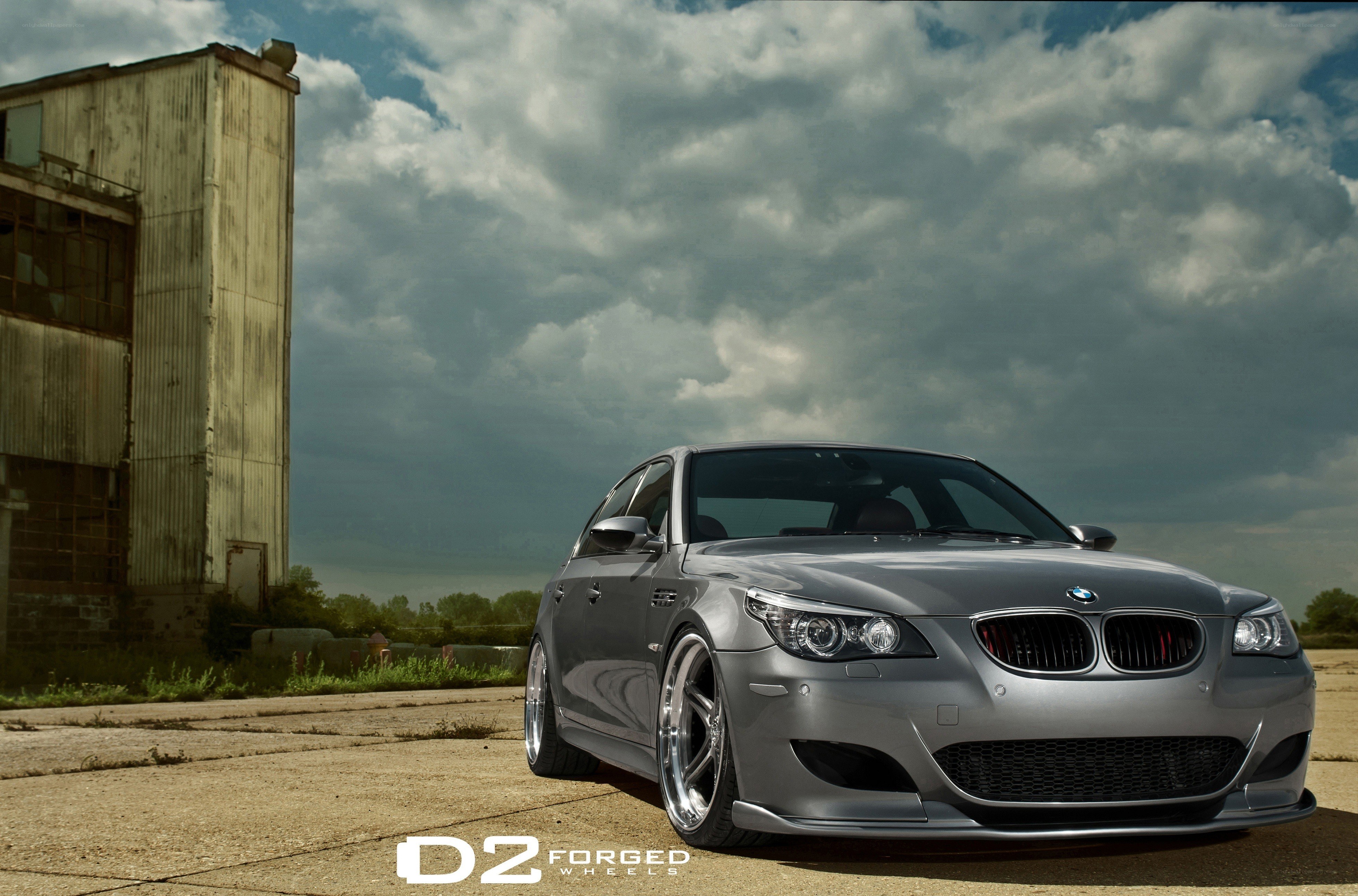 silver bmw m5 on concrete