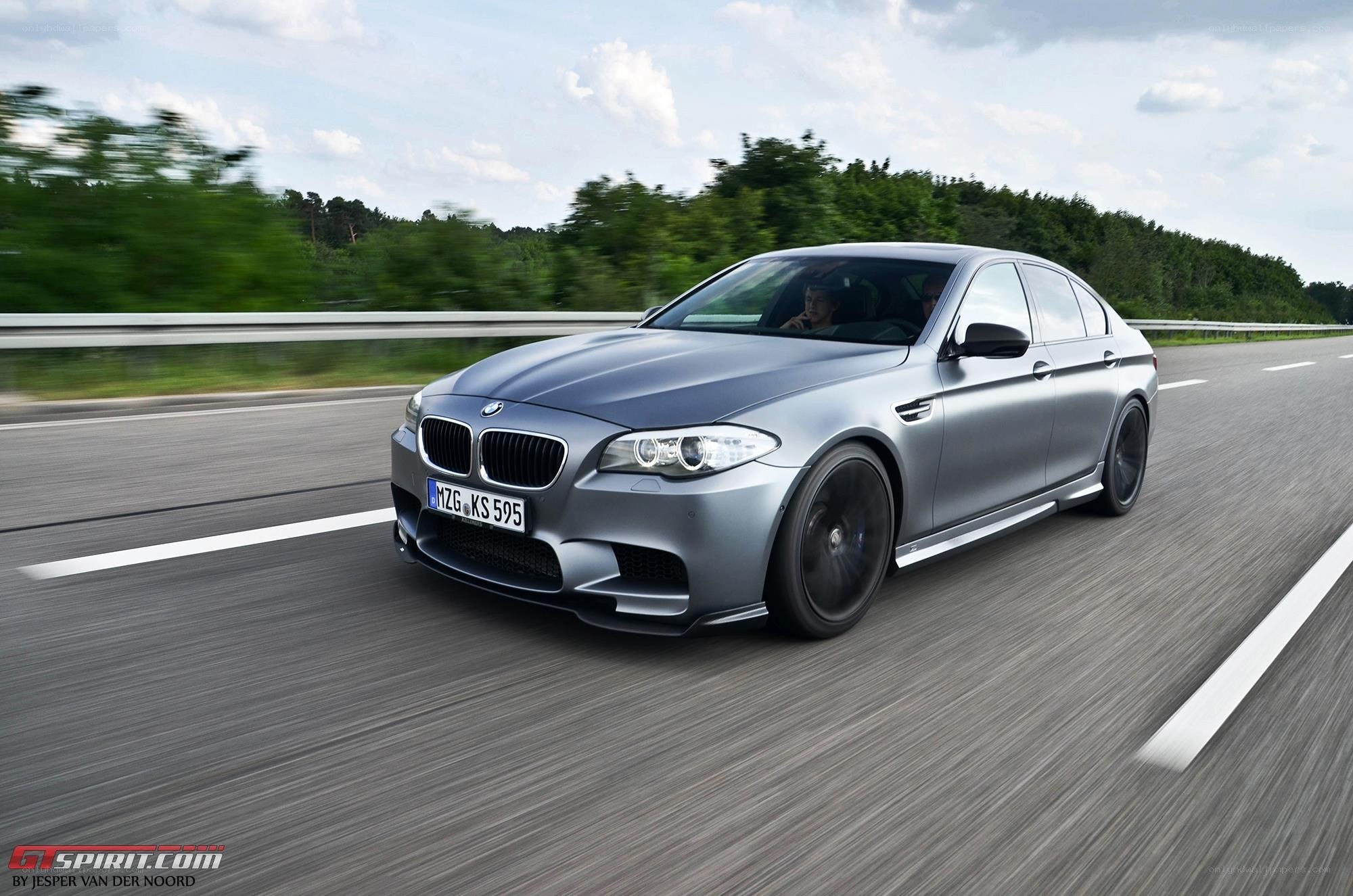 silver bmw m5 on highway