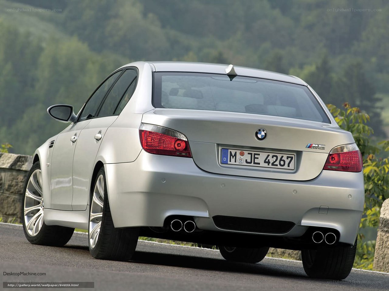silver bmw m5 on mountain road