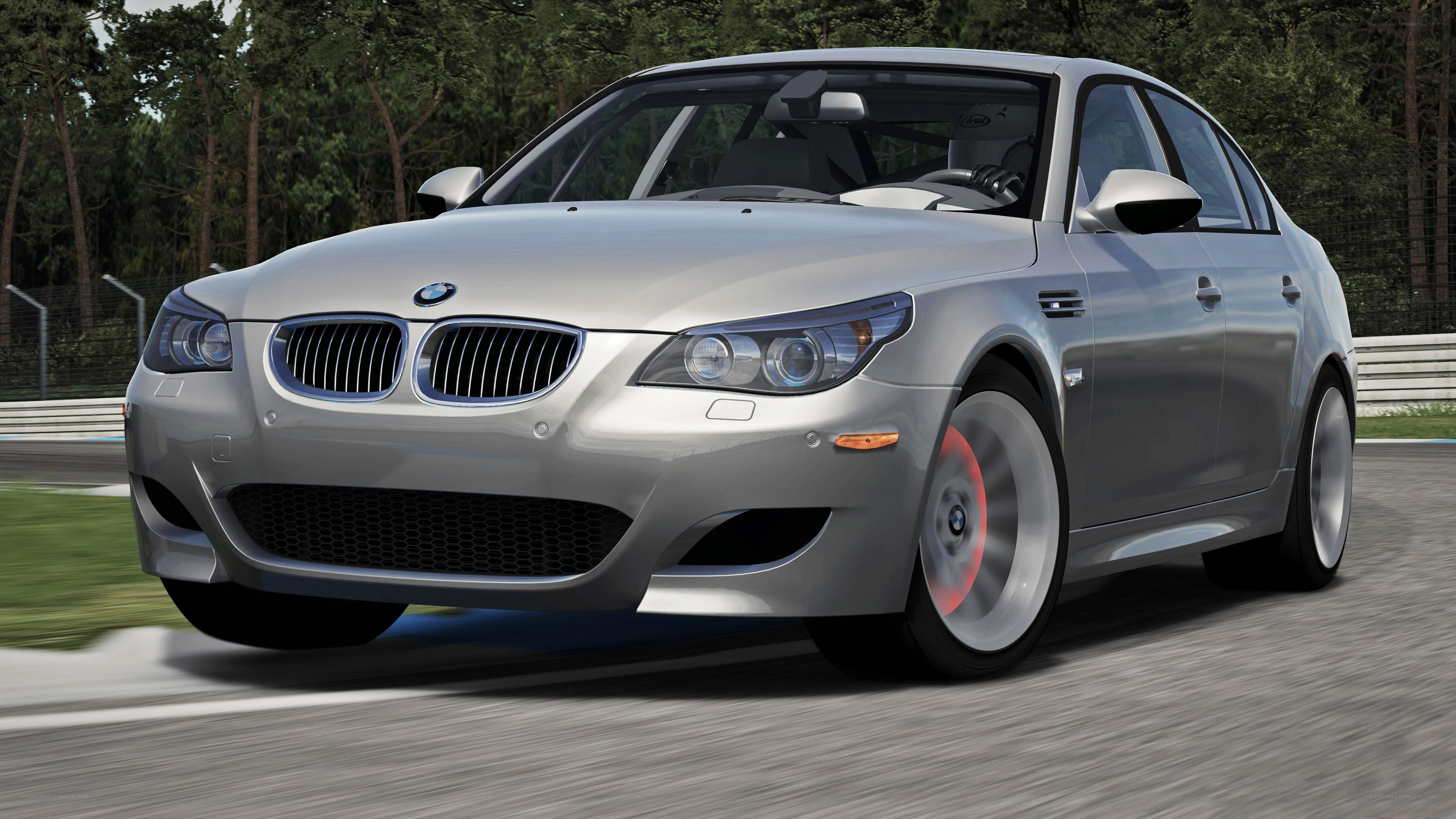silver bmw m5 on racetrack