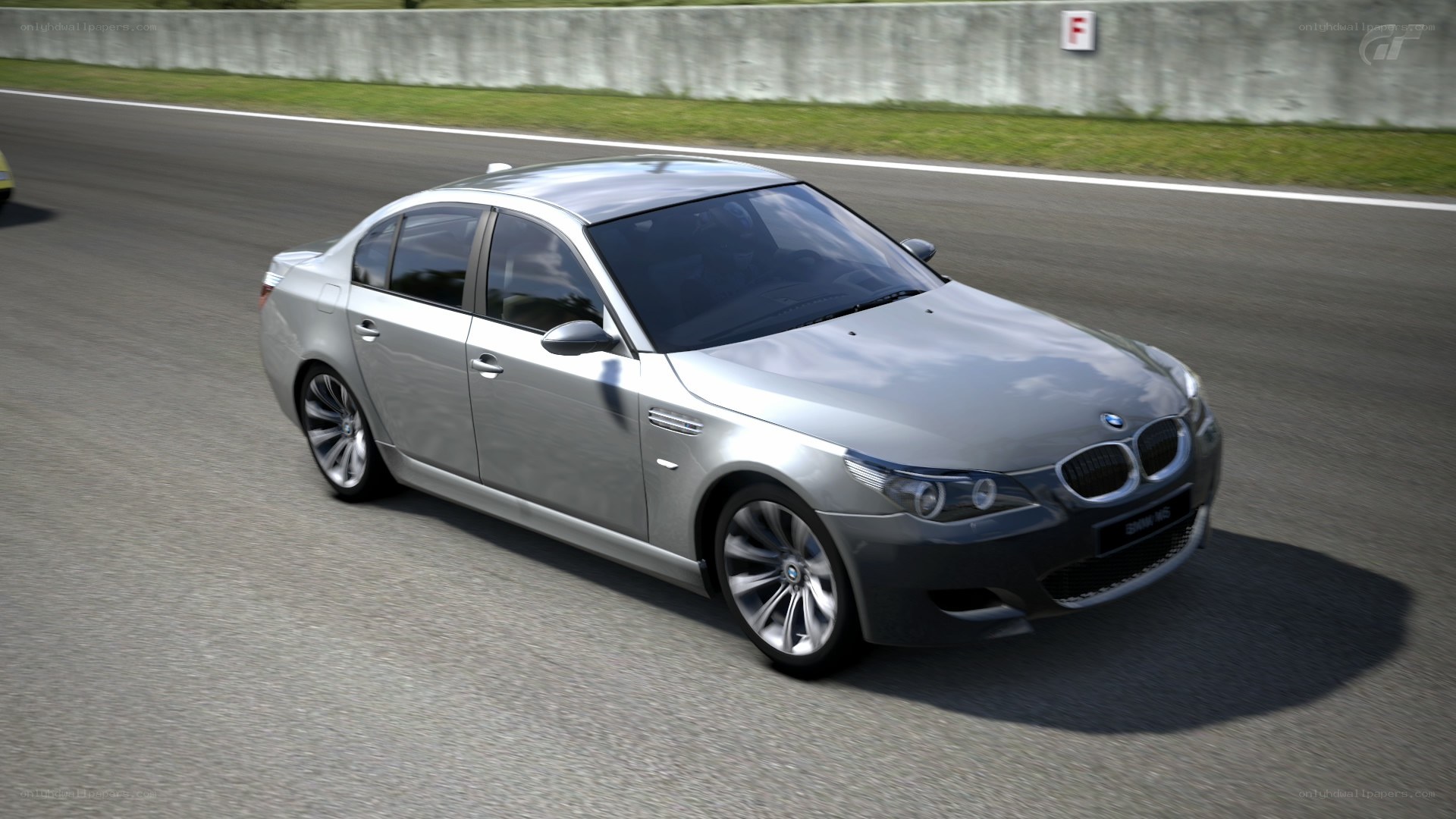 silver bmw m5 on racetrack
