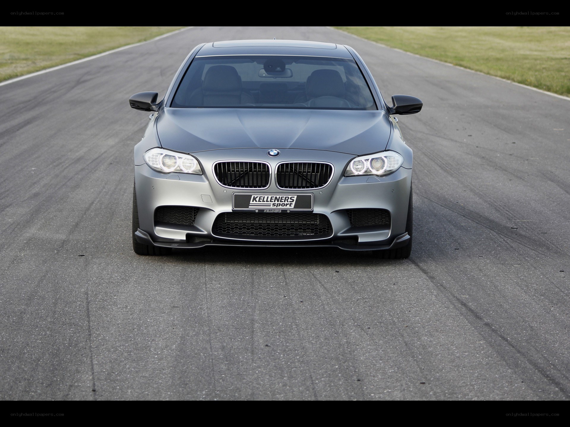 silver bmw m5 on racetrack