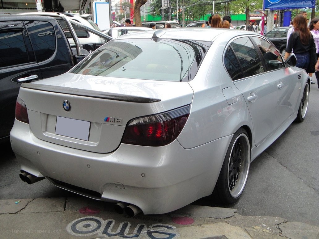 silver bmw m5 on street