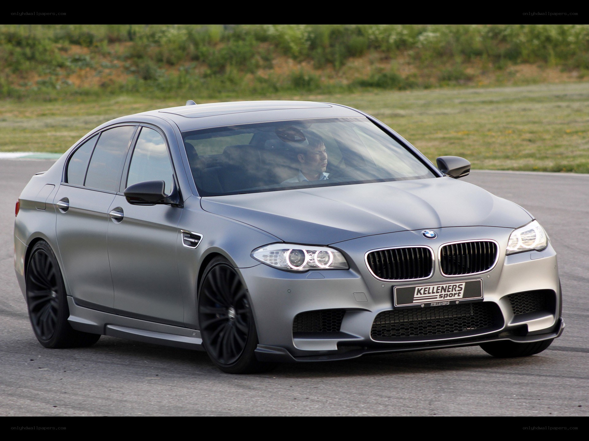 silver bmw m5 on track