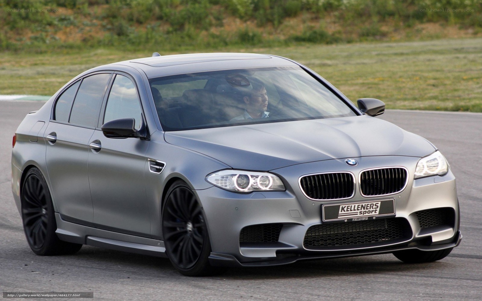 silver bmw m5 on track
