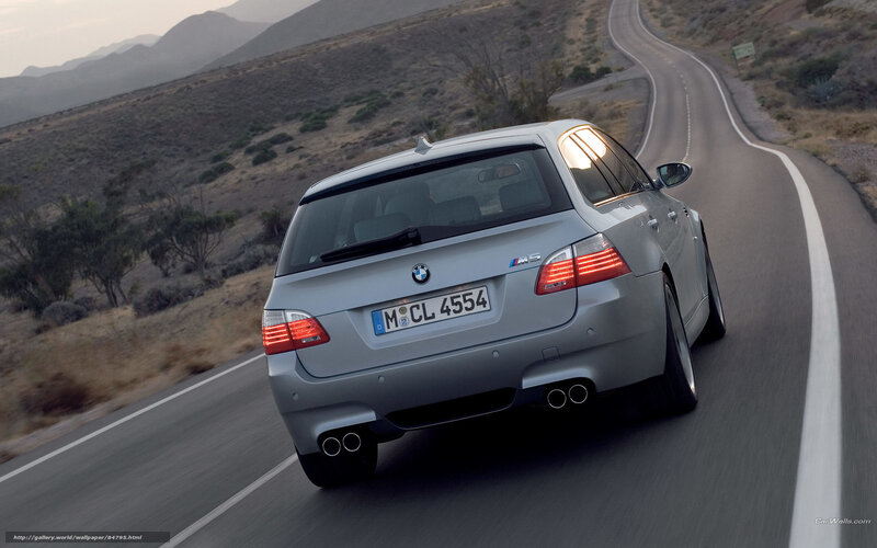 silver bmw m5 on winding road