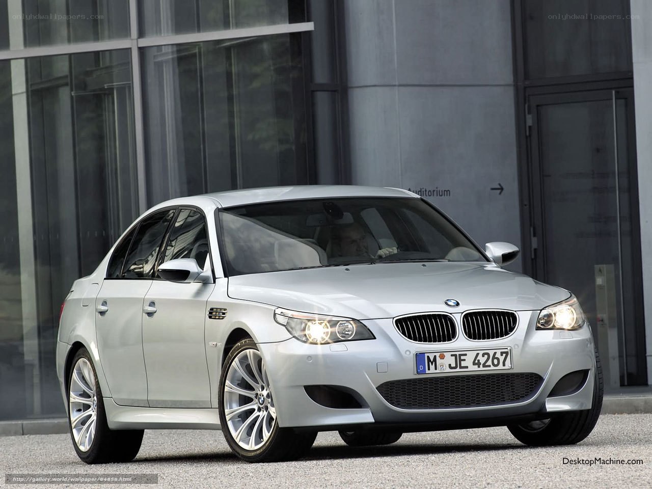 Silver BMW M5 parked outside