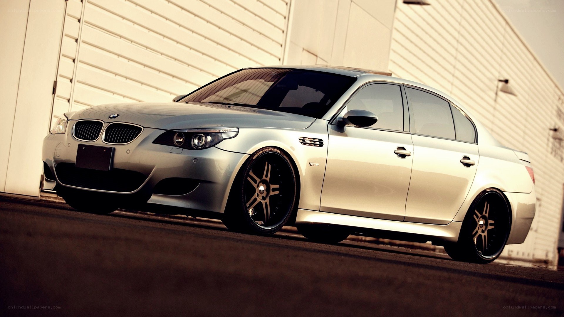 silver bmw m5 sedan