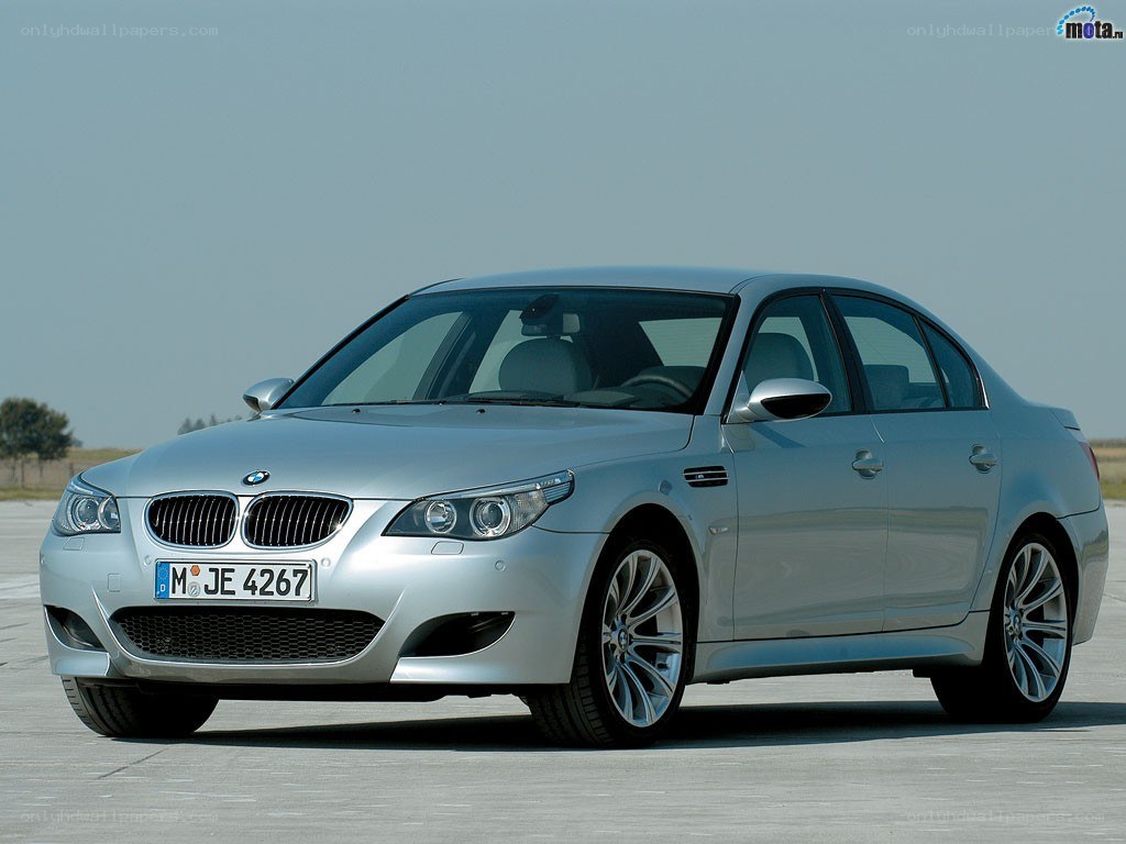 silver bmw m5 sedan