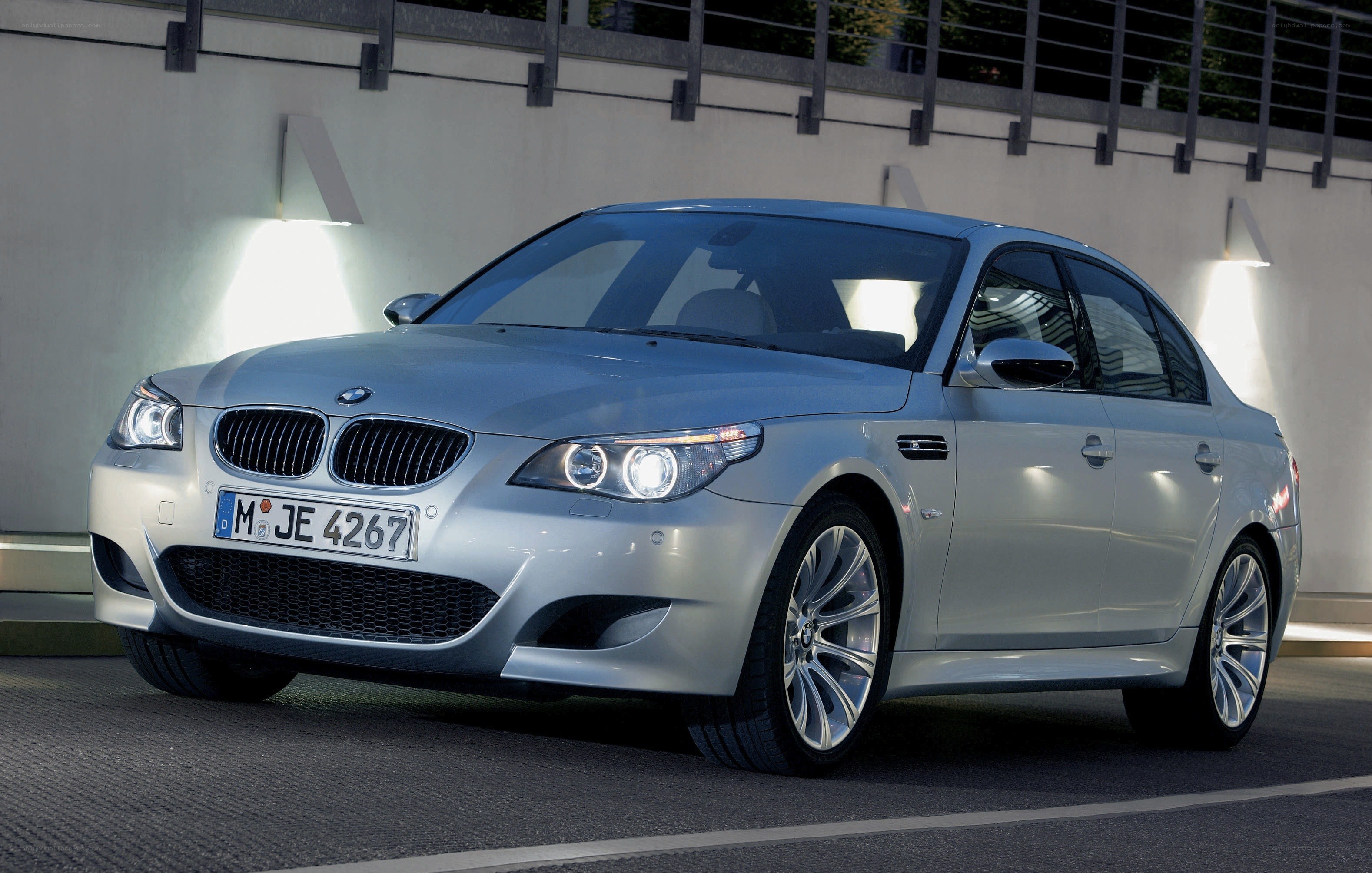 silver bmw m5 sedan