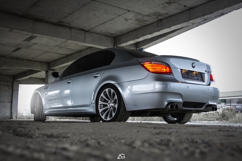 Silver BMW M5 Sedan — Dramatic, Photograph, Concrete Structure, Tire