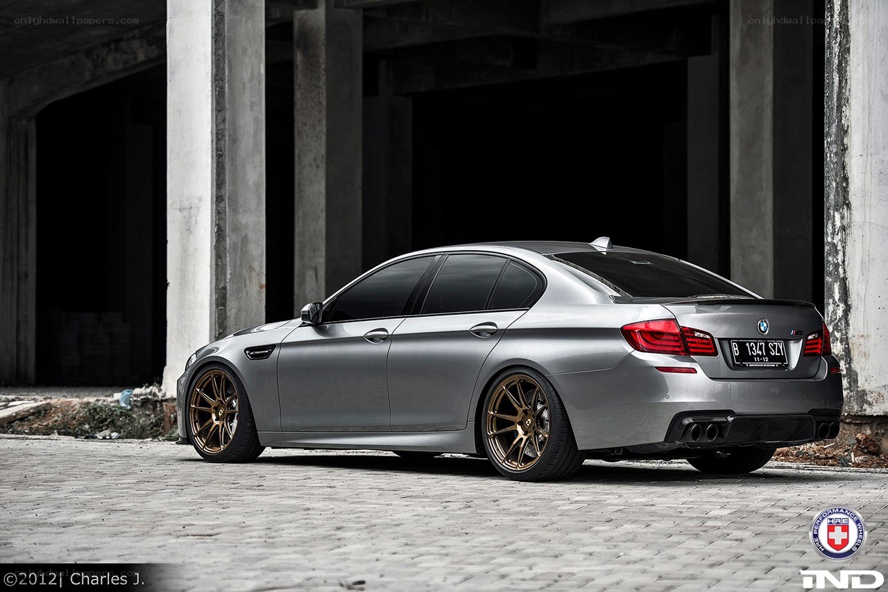 silver bmw m5 with gold wheels