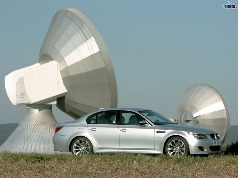 Silver BMW M5 with satellite dishes
