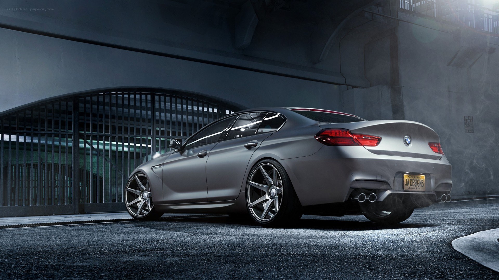silver bmw m6 in garage