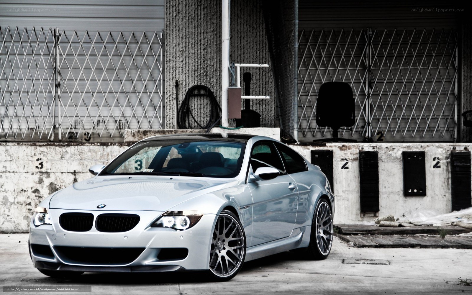 silver bmw m6 in industrial setting