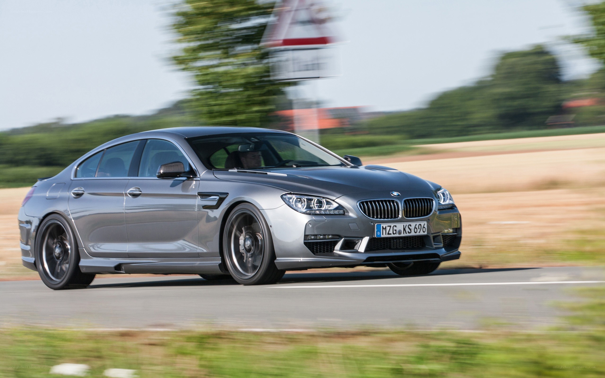 silver bmw m6 in motion