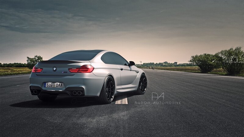 silver bmw m6 on a road
