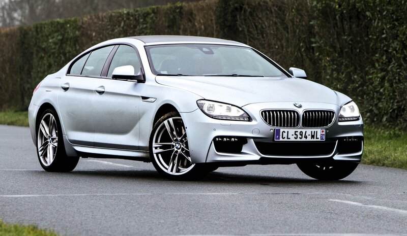 silver bmw m6 on road