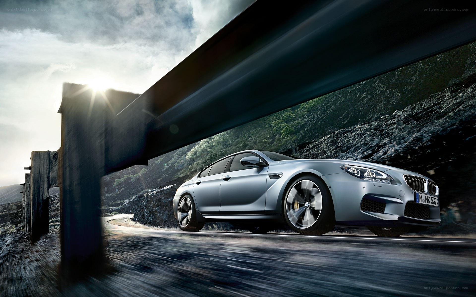 Silver BMW M6 on winding road