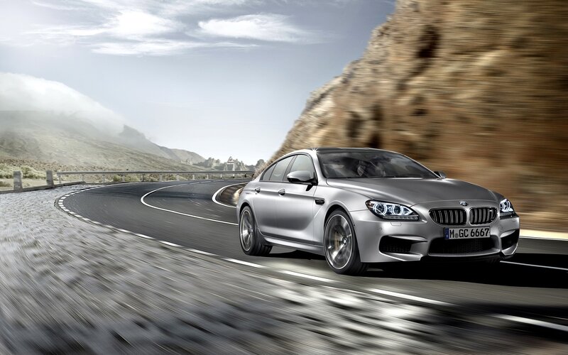 Silver BMW M6 on winding road