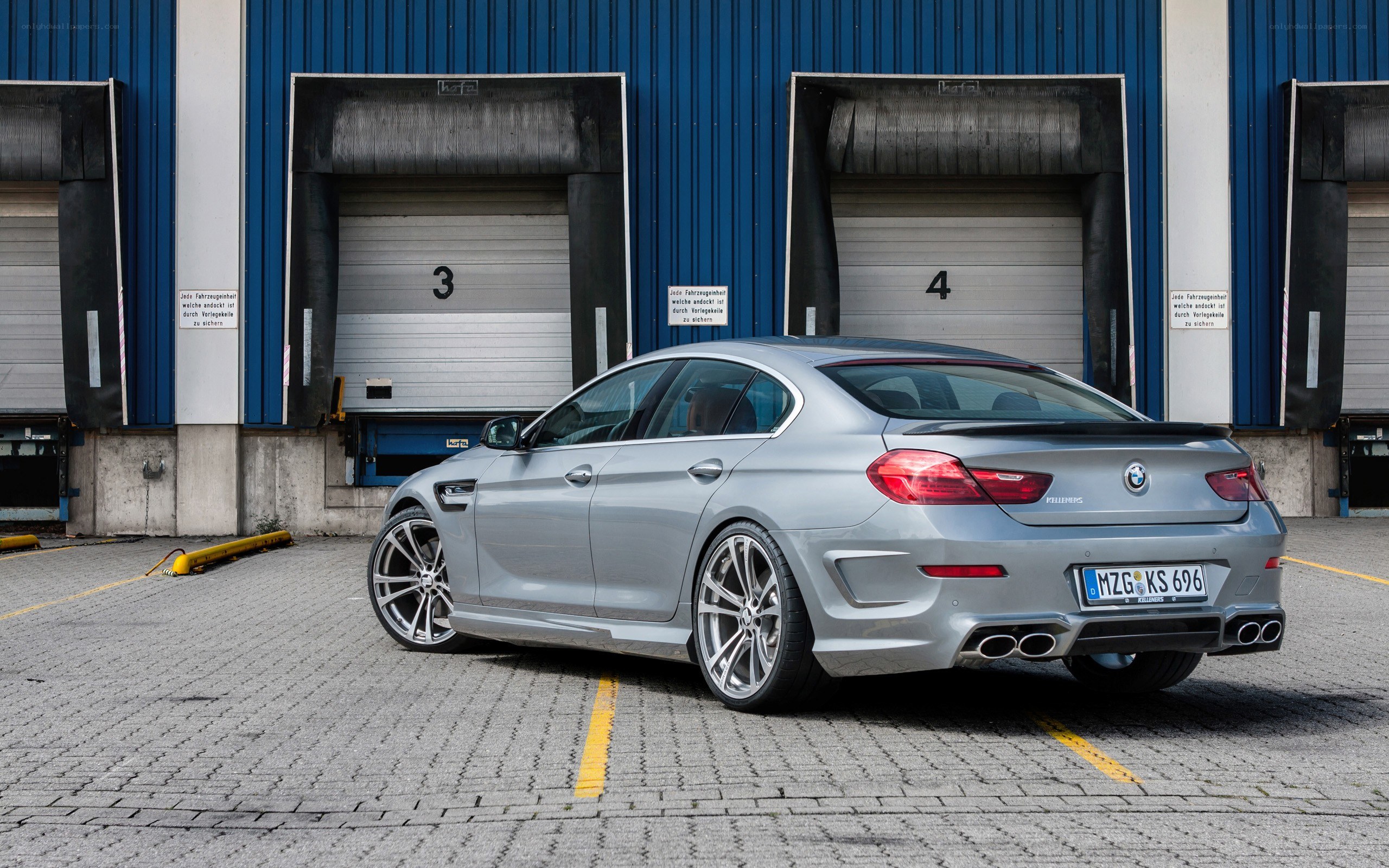 Silver BMW M6 parked at loading bay