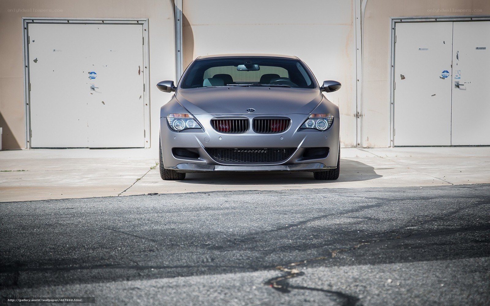 silver bmw m6 parked in garage