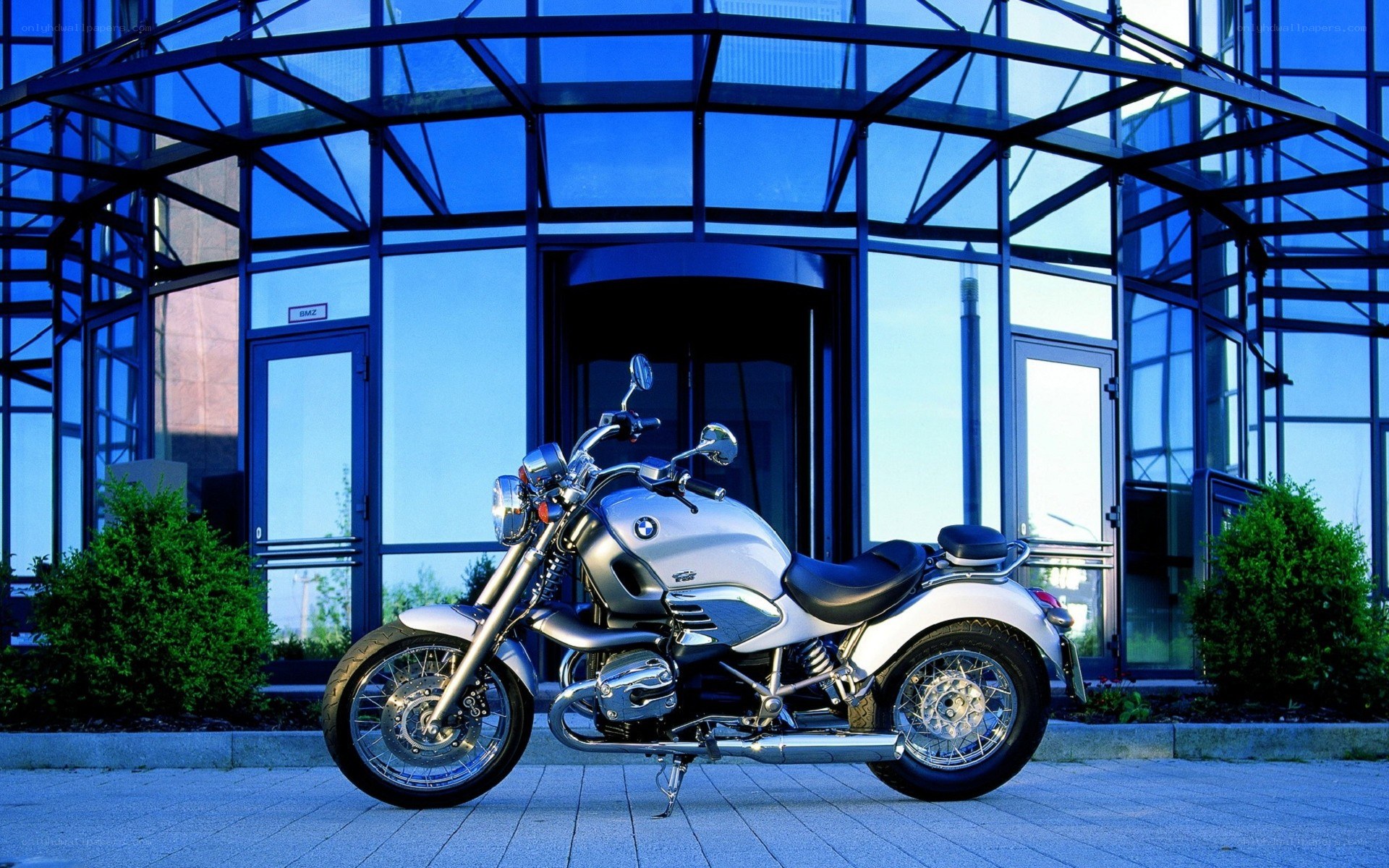 Silver BMW motorcycle outside building